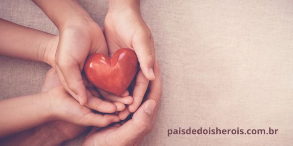 alt="rotina de cuidados crianças com necessidades especiais mãos unidas"